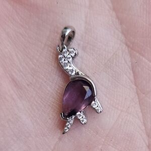 Elegant Silver and Purple Dinosaur Pendant